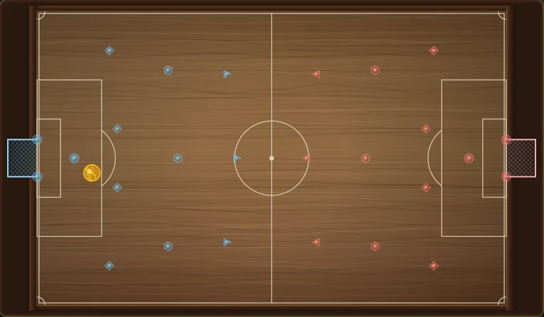 Nailball Goal masası: solda mavi, sağda kırmızı 11'er çivi, iki kale ve mavinin yarı sahasında bozuk para disk. Bir 1v1 maç başlamadan önceki an.